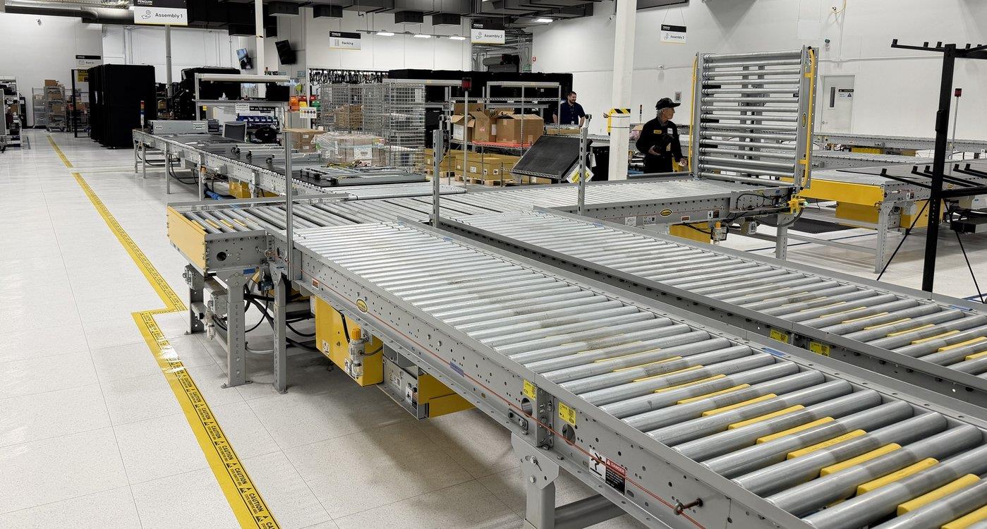 Conveyor-fed rack integration line