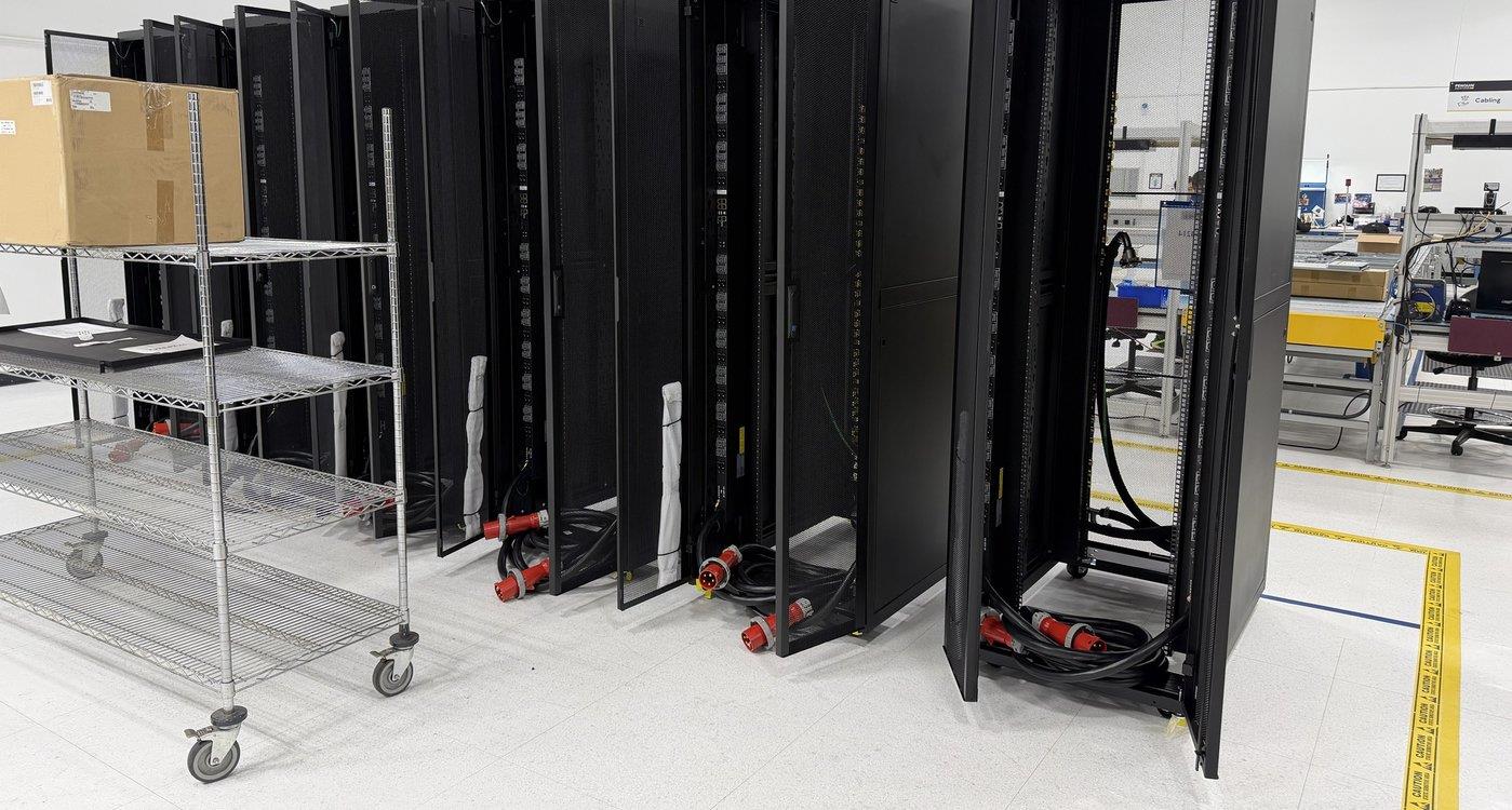 Row of integrated server racks with power connectors